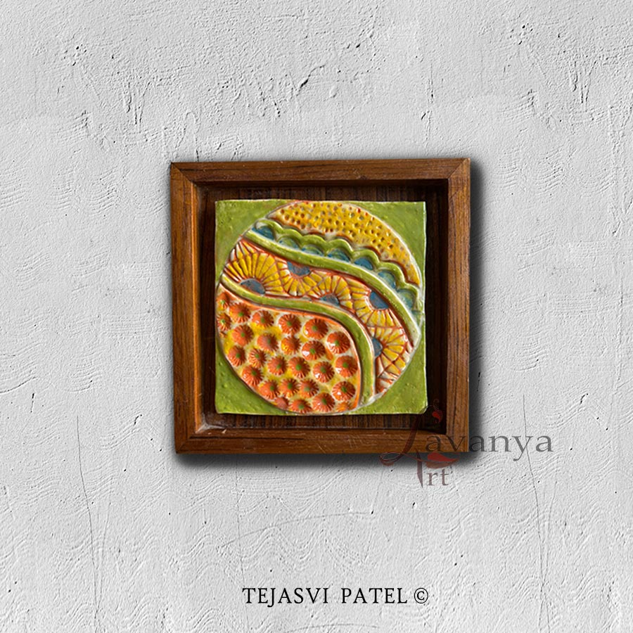 Handmade ceramic wall sculpture framed in teak wood by Tejasvi Patel. Lavanya Art Studio presents original Indian art with stunning textured art.