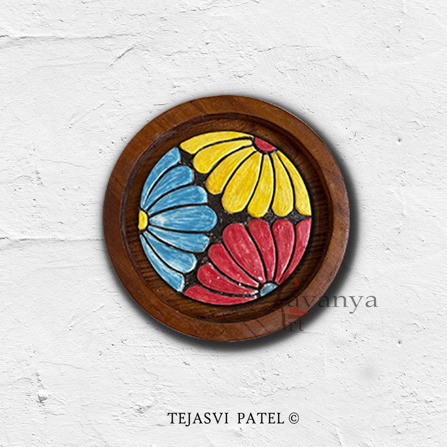 Add artistic charm with handmade ceramic wall sculpture by Tejasvi Patel. Lavanya Art Studio offers Indian art with textured art, framed in teak wood.