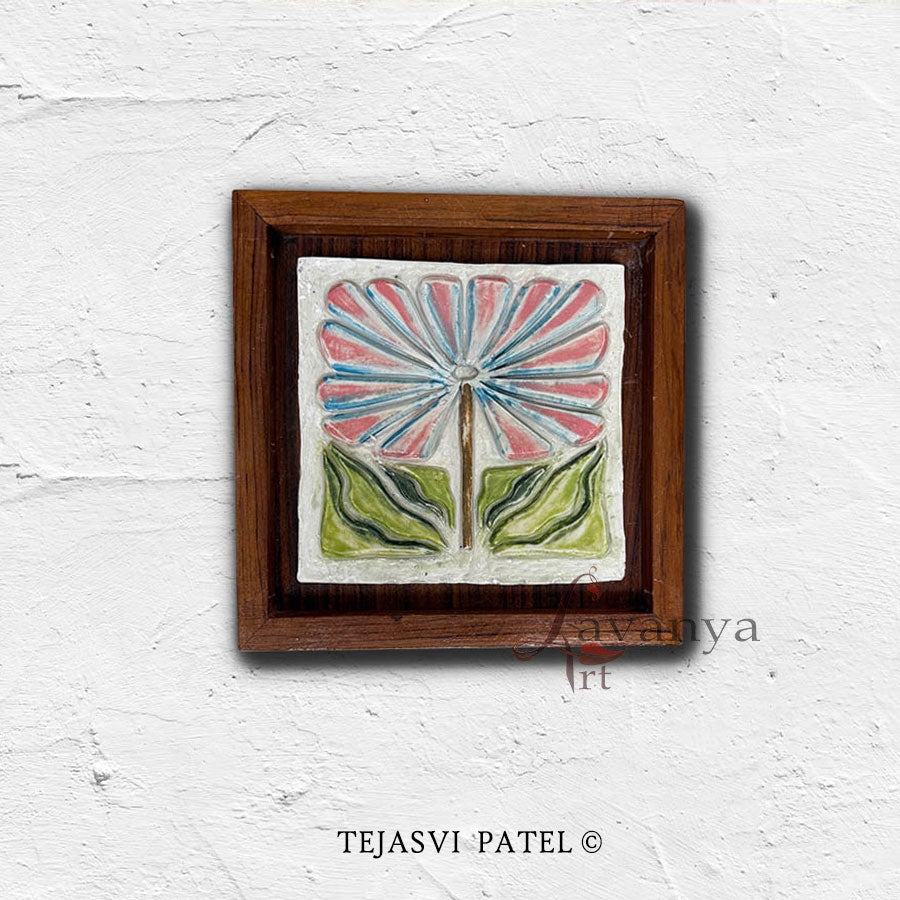 Bring warmth to your interiors with handmade ceramic wall sculpture by Tejasvi Patel. Lavanya Art Studio offers Indian art with textured art in teak wood.