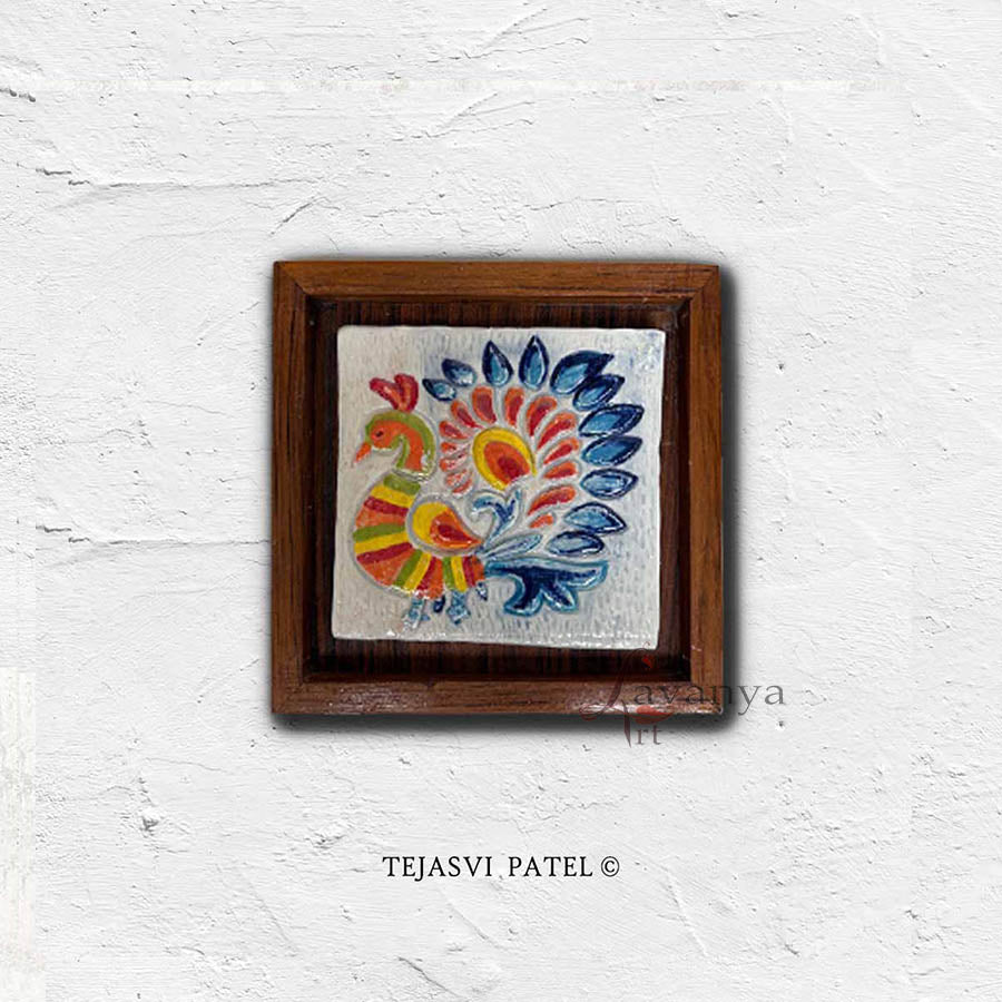 Add artistic charm with handmade ceramic wall sculpture by Tejasvi Patel. Lavanya Art Studio offers Indian art with textured art, framed in teak wood.